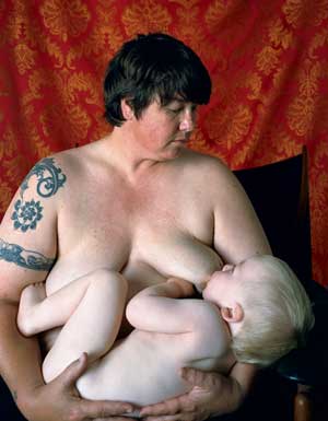 Catherine Opie - photographer.  she has Pervert carved into her chest.